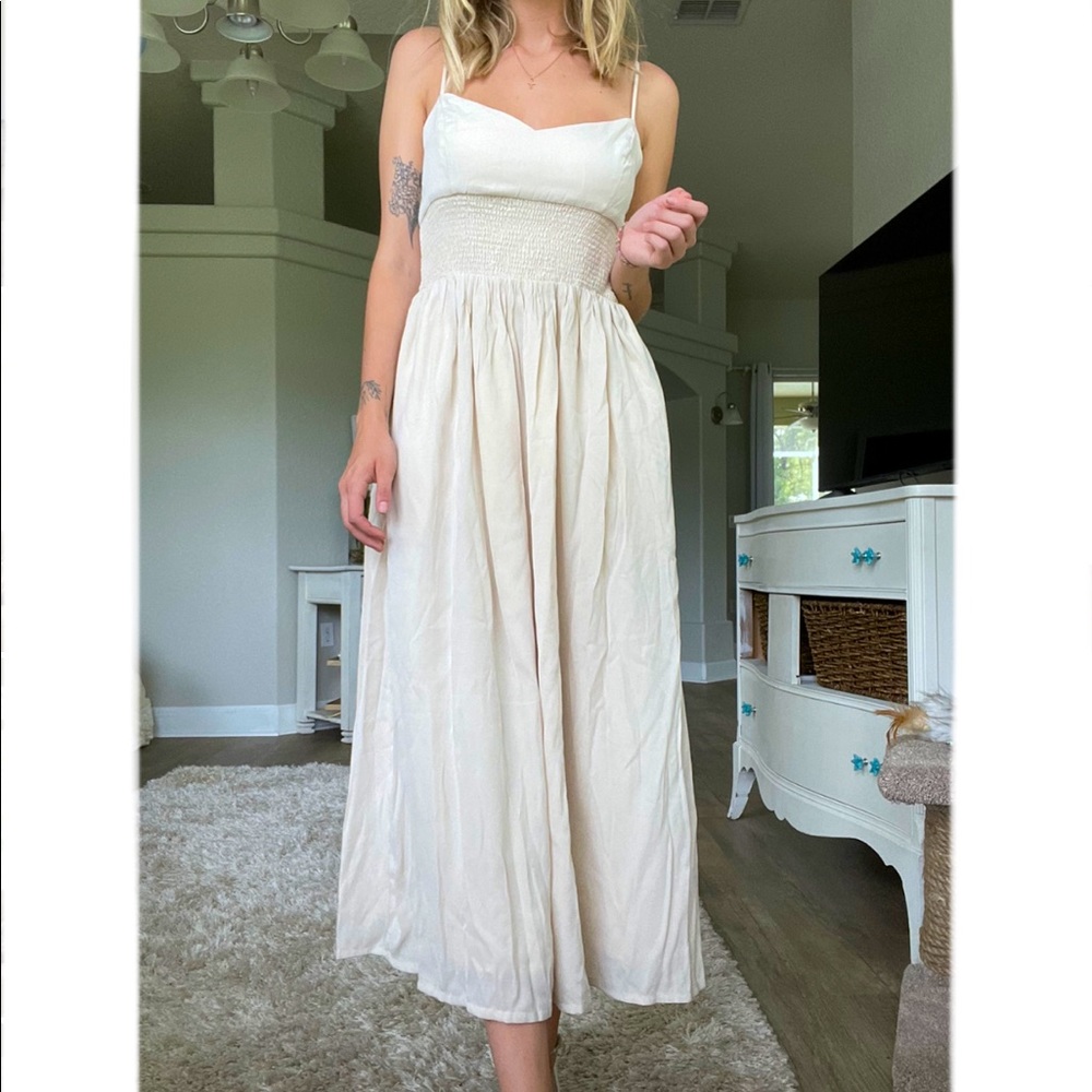 Tan dress, brand Lulus. Never worn still with tags. Size small.
